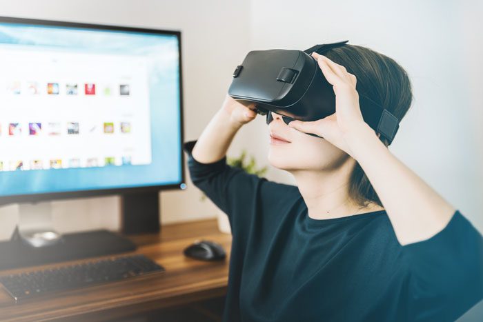 women wearing a virtual reality headset